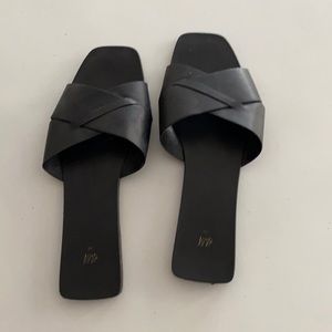 Black HM leather slides. Size 38